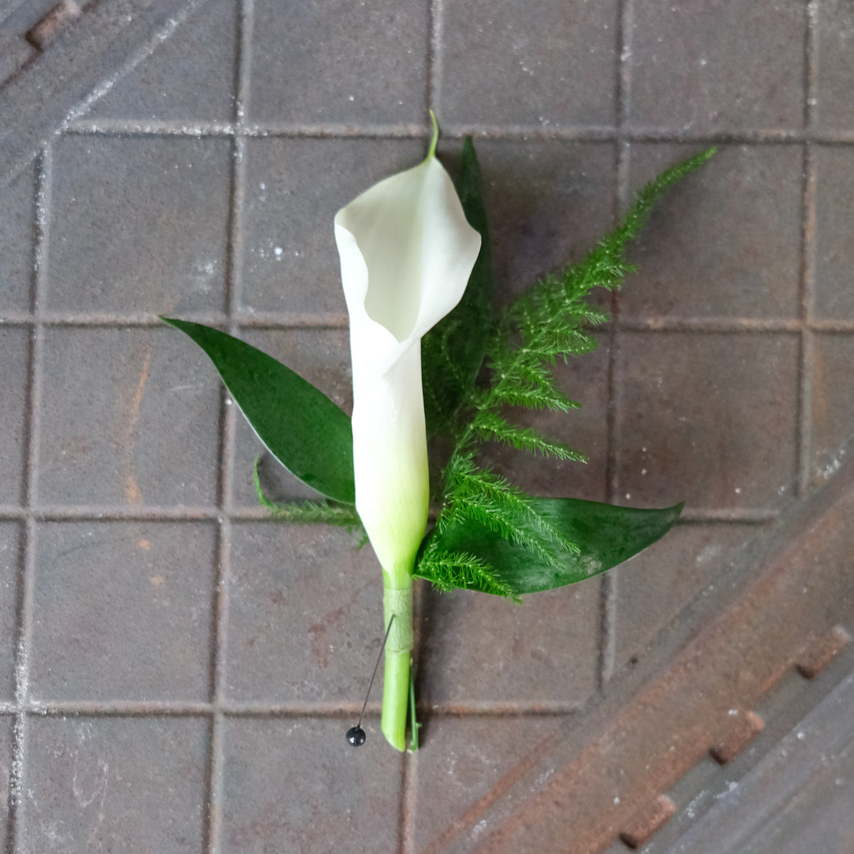 white calla lily buttonhole Calla Lily Boutonniere by Michler's Florist