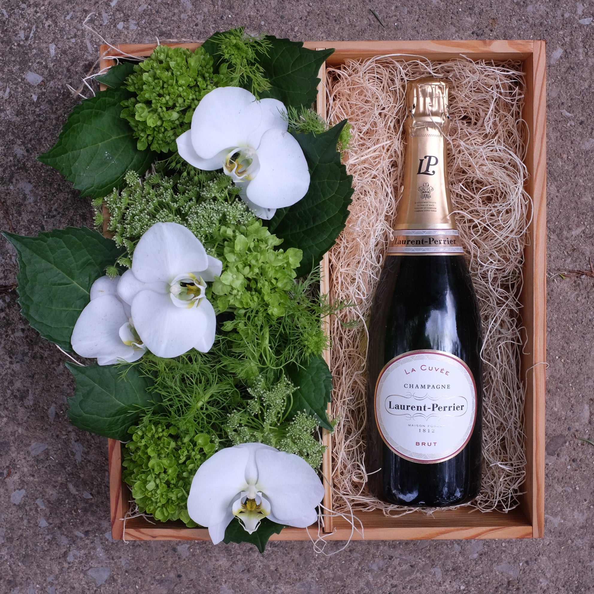 Champagne wine gift crate with orchid flowers
