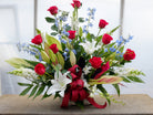 Denmark Funeral Basket: Red Roses, White Lilies, Delphinium and Snap Dragons. Designed by Michler's Florist in Lexington, KY