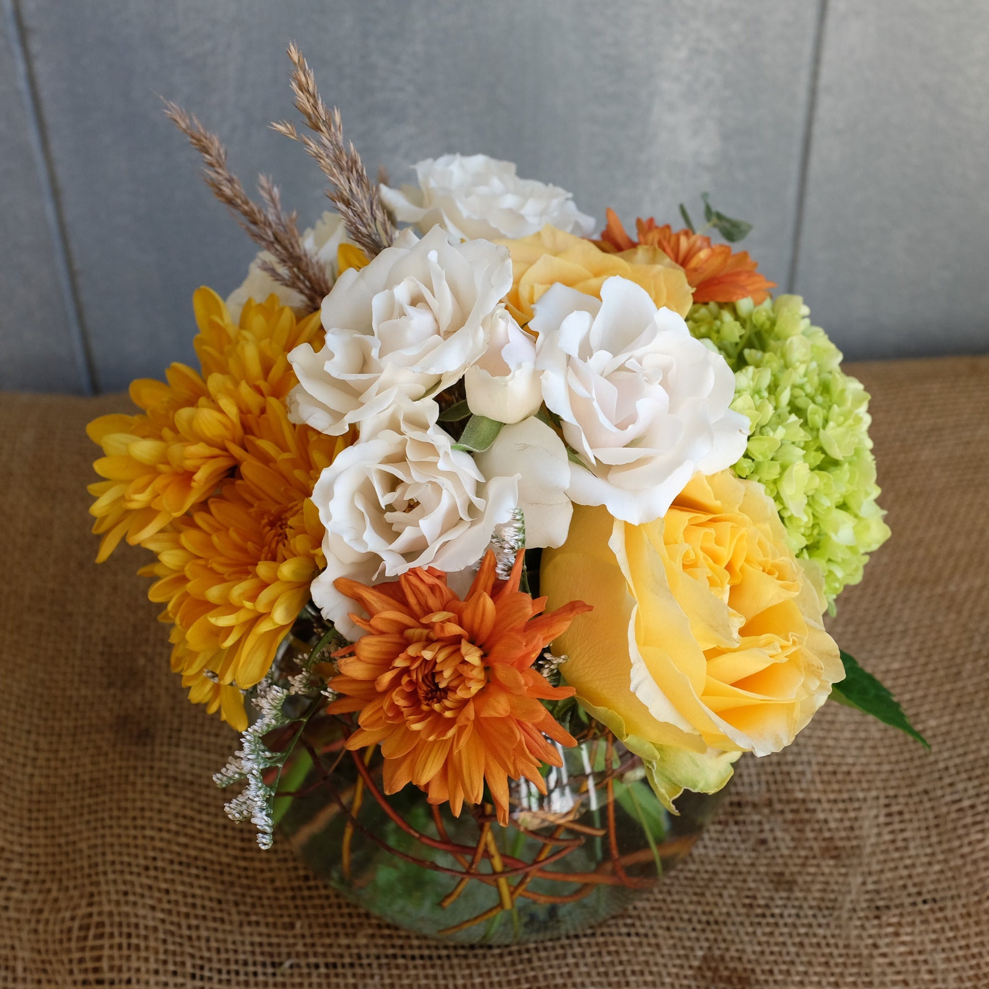 Lush flower bouquet in muted autumn tones.
