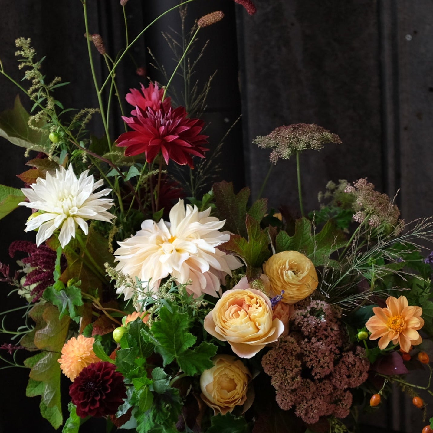 Dynamic bouquet with garden roses, dahlias and field flowers