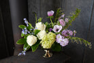 Alcott Flower Design iwth Solomon Seal, Spanish Blue Bells and Anemones by Michler's Florist