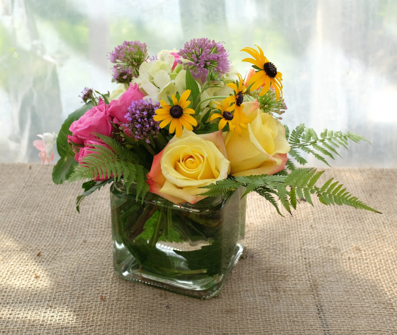 Austin Flower Arrangement: Summer Flowers including Allium, Roses, and Black-eyed Susans. Designed by Michler's in Lexington, KY