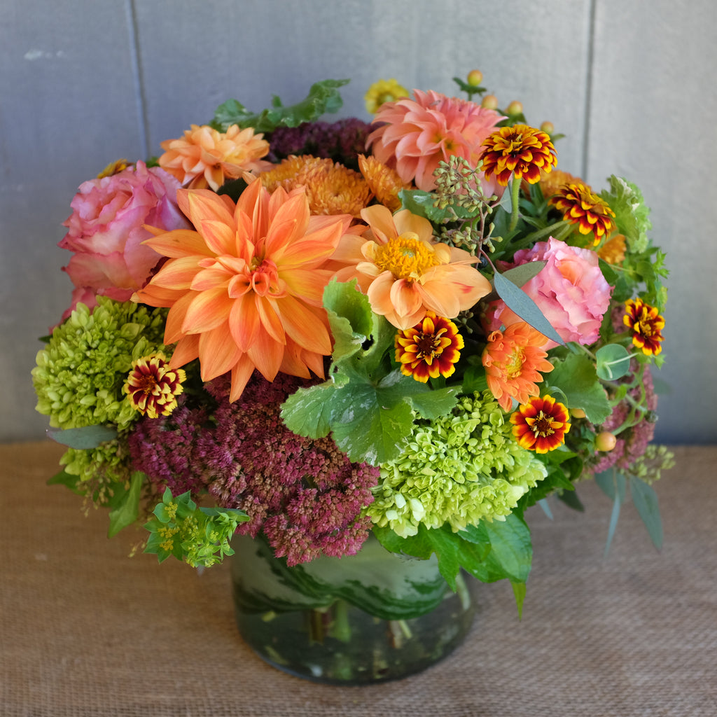 Bright and cheery flower arrangement by Michler's