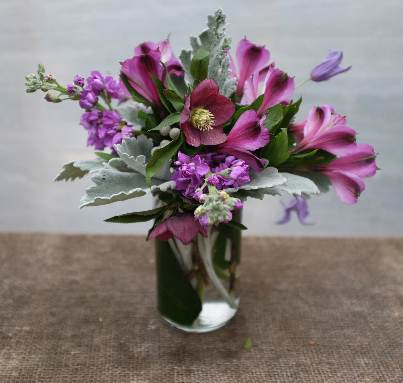 Berry: Purple Alstromeria, Stock, Hellebore and Dusty Miller.  Designed by Michler's in Lexington, KY