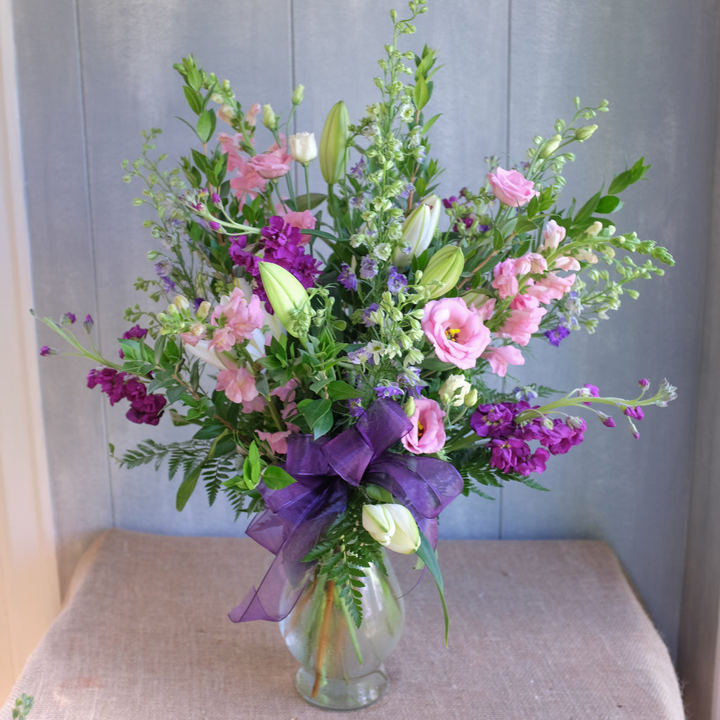 tall and elegant flower arrangement with lilies, lisianthus, and stock by Michler's Florist in Lexington, KY