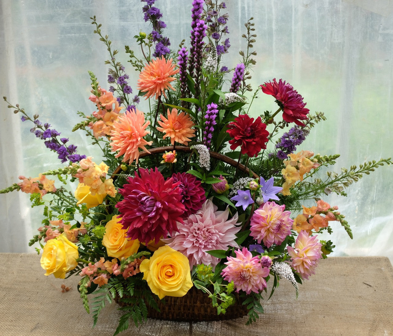 Large Colorful Funeral Flower Basket with Dahlias, Liatris, Larkspur, and Roses | Michler's Florist