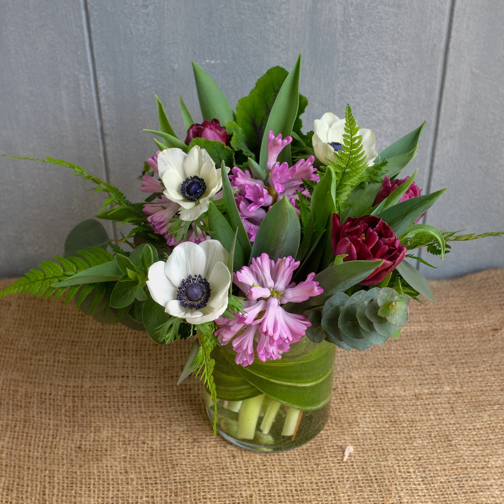 Carmona Flower Arrangement with Hyacinth, Anemones and Tulips by Michler's Florist