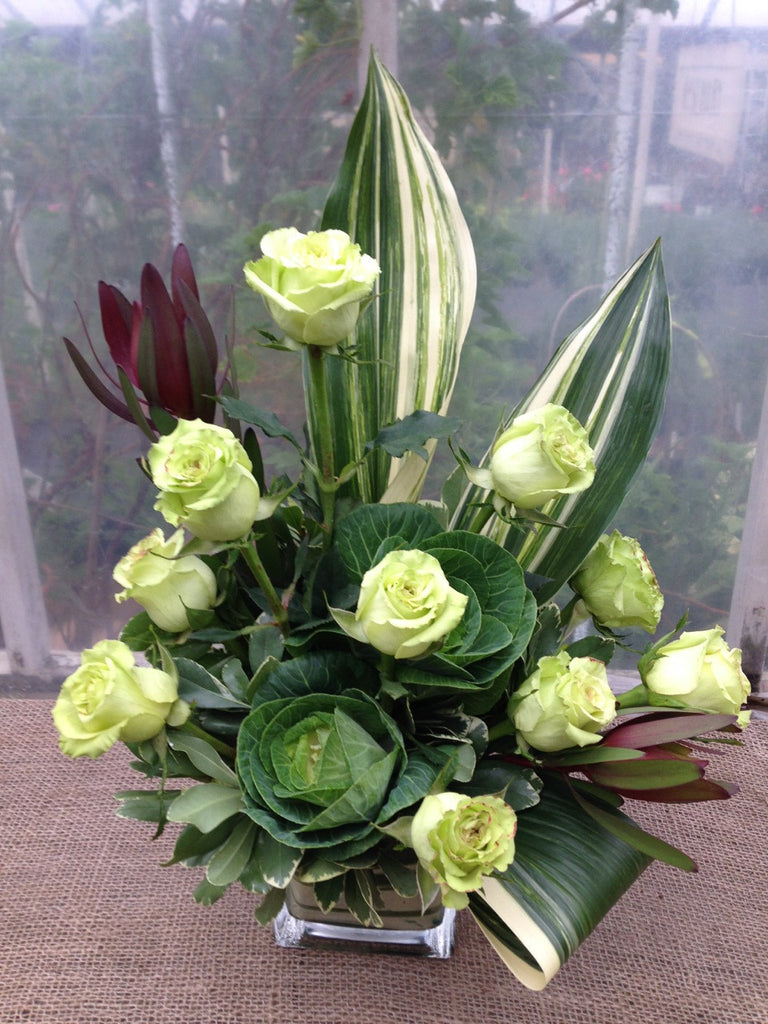 Castlewood: Flower arrangement with green roses and cabbage. Michler's Florist