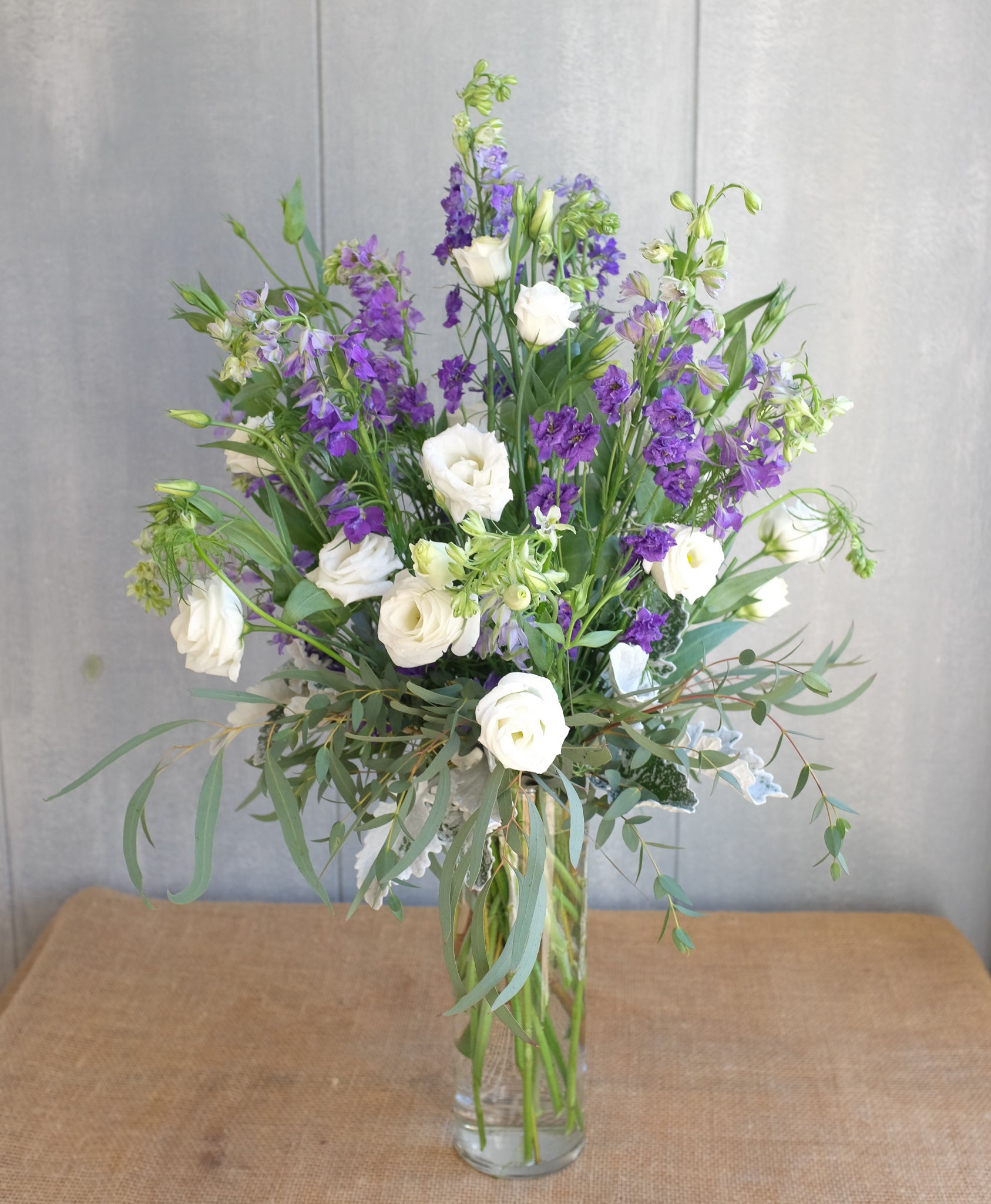 Lavender and white flower arrangement by Michler's Florist