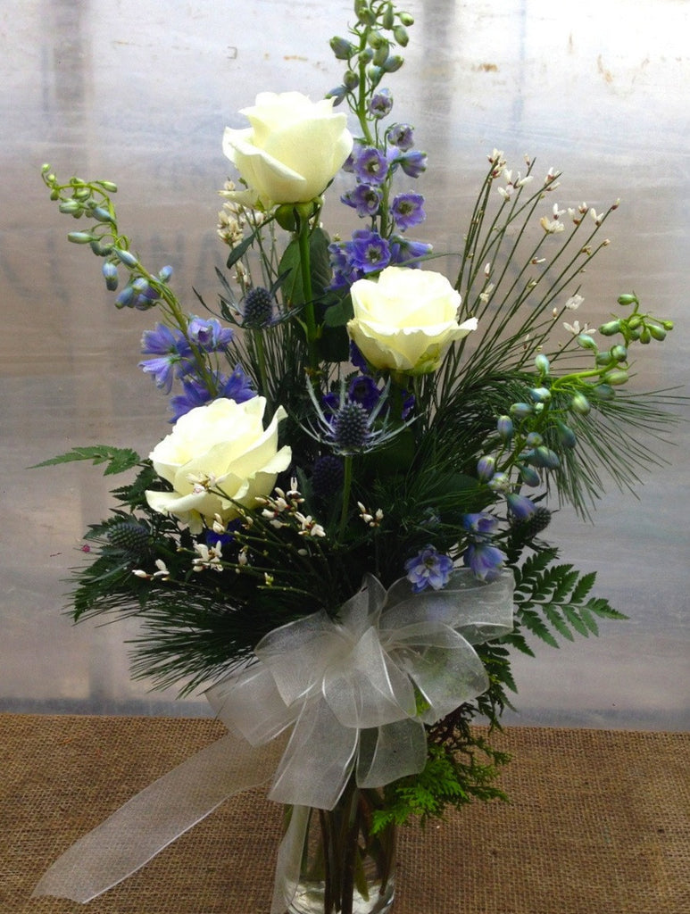 Cooper: White Roses, fragrant Ginestra, and Blue Delphinium.  Designed by Michler's Florist in Lexington, KY