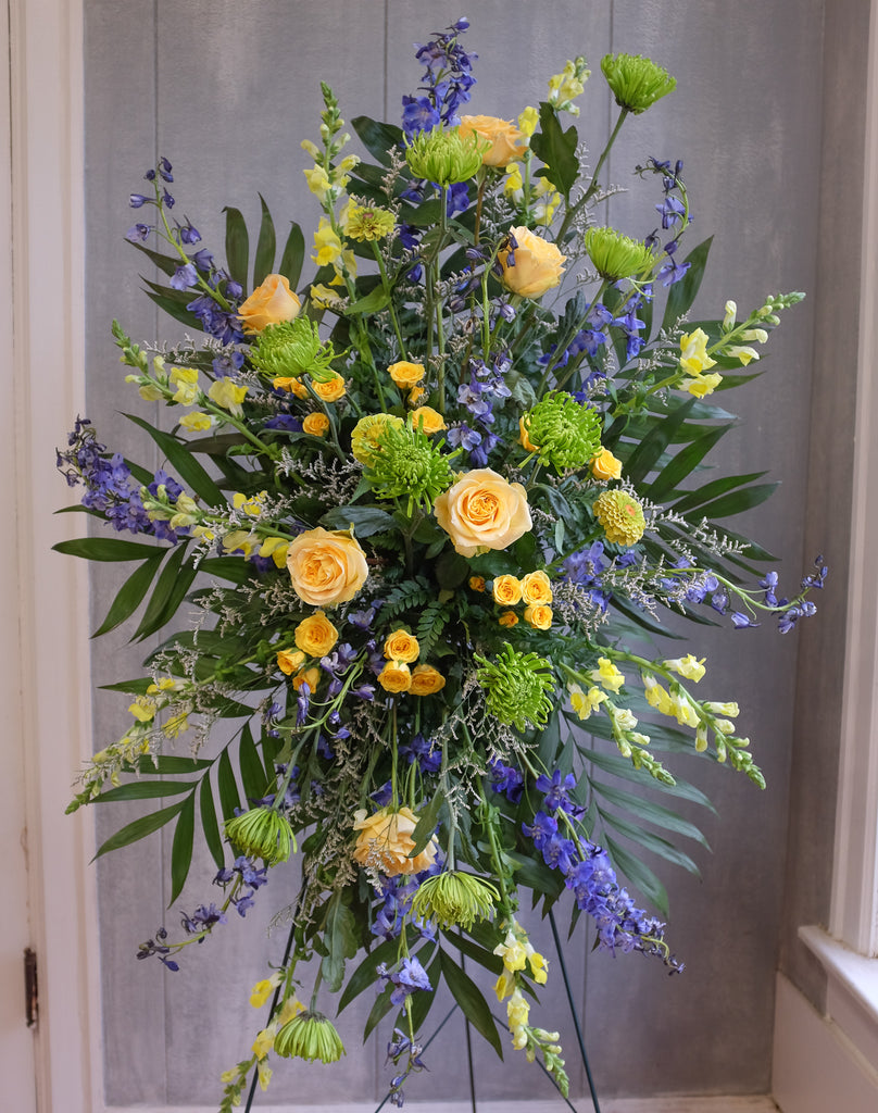 floral easel spray with roses, larkspur, and stock by Michler's Florist in Lexington, KY