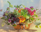 Fun fall basket with pumpkins and seasonal flowers by Michler's Florist.