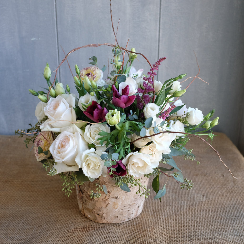 white roses, ranunculus, curly willow floral design by Michlers Florist