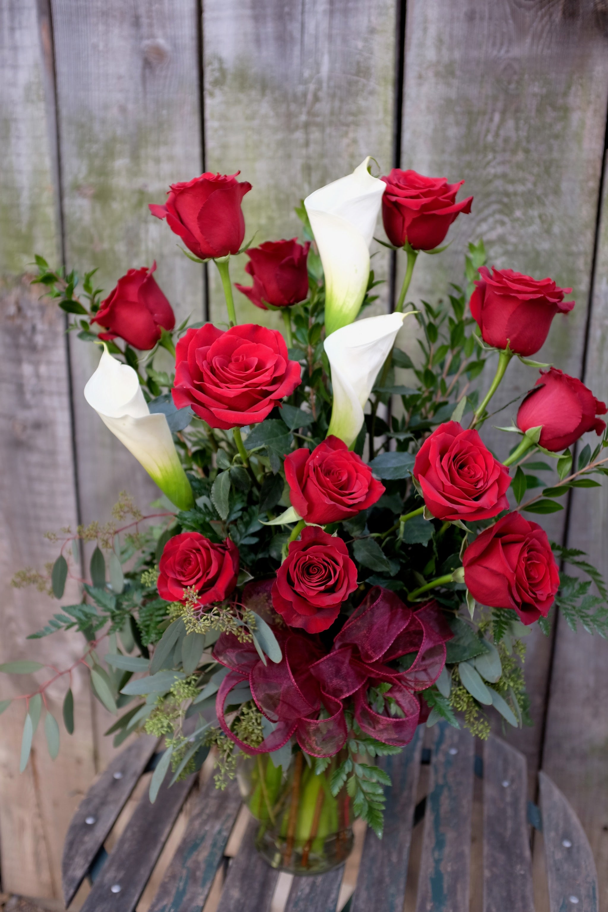 Red roses and white calla lilies designed in Lexington, KY by Michler's Florist 