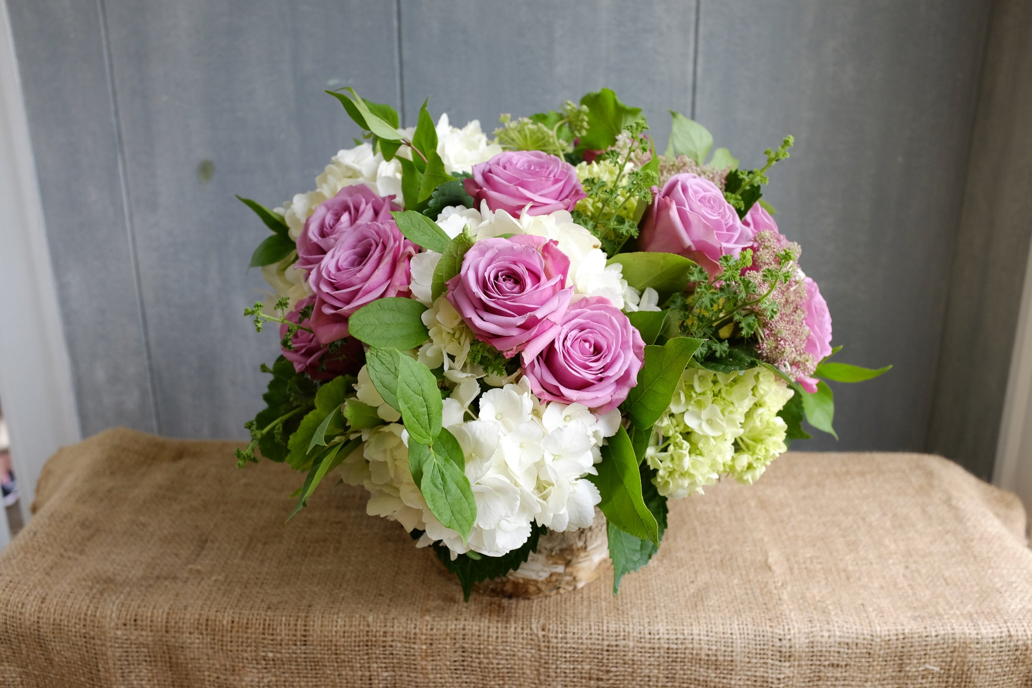 Floral Arrangement by Michler's Florist with pink roses and white hydrangeas