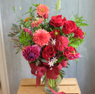 Fairhaven: Red Roses and Dahlias in a vase arrangement
