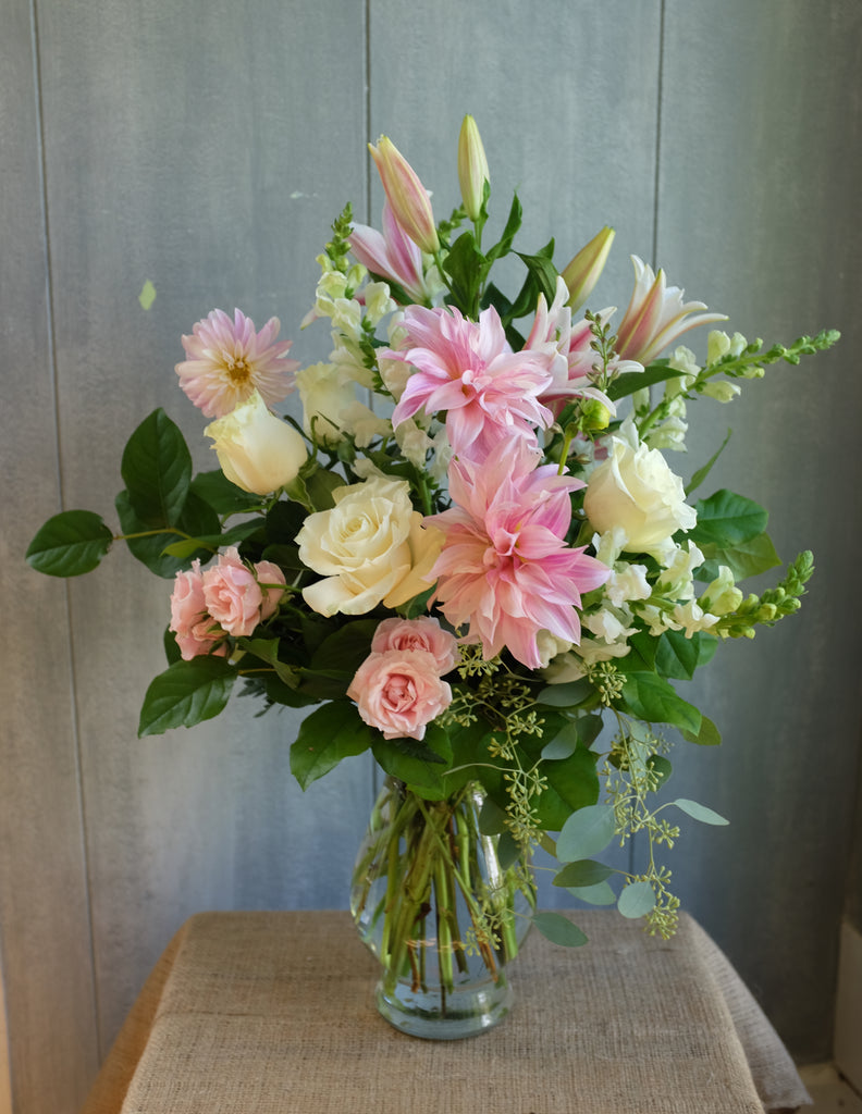 Lovell floral design with blush Dahlias, white and pink roses and stargazer lilies.  Designed by Michler's Florist in Lexington, KY
