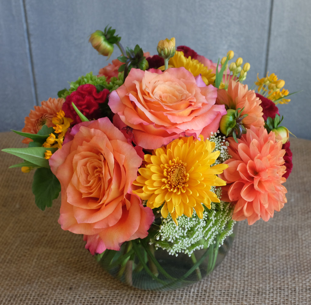 Colorful low and lush arrangement by Michler's Florist