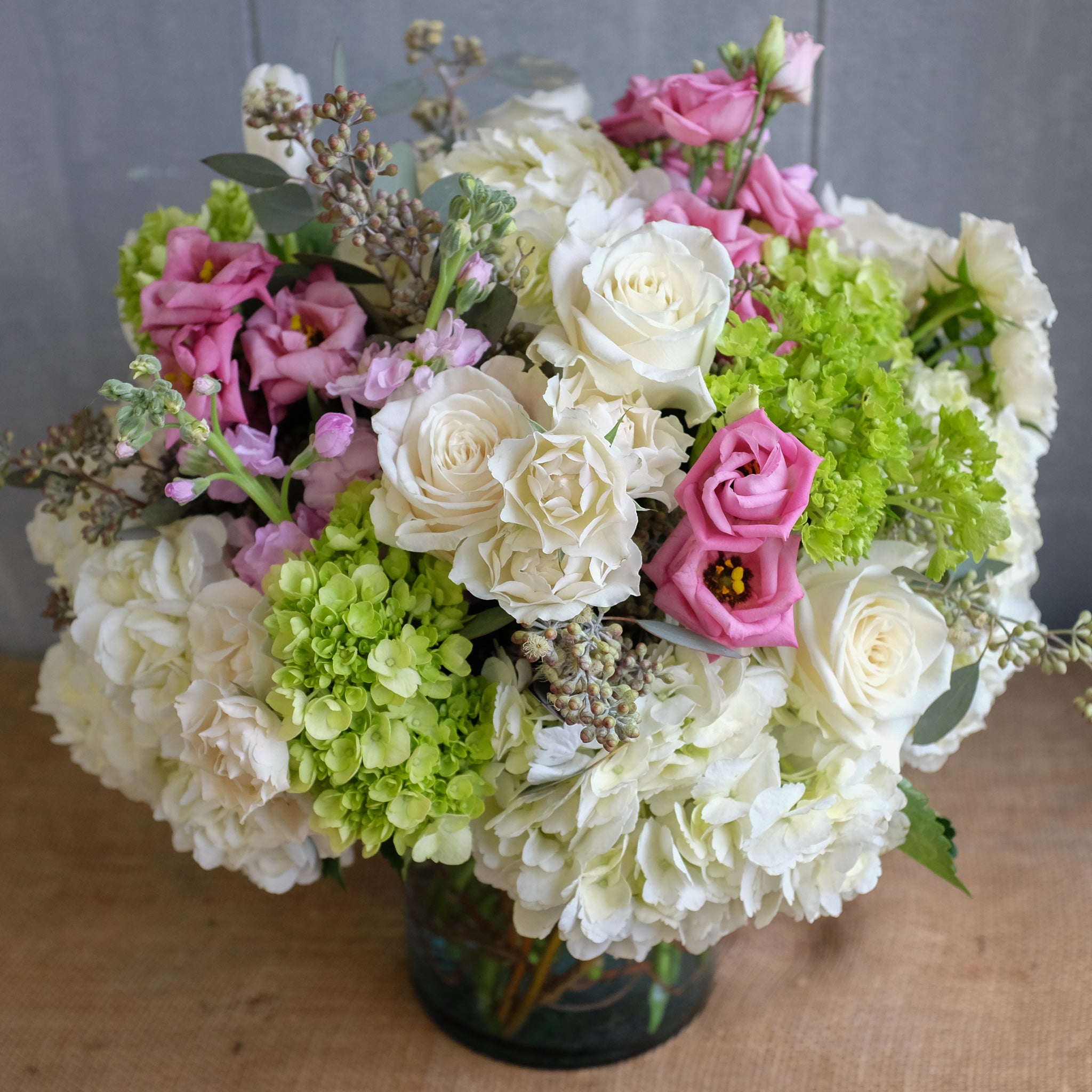 Feminine bouquet of pink and white flowers by Michlers Florist.