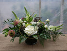 Floral Centerpiece with Ranunculus, Privet Berry, Snapdragons , Freesia, and Hydrangea | Michler's Florist 