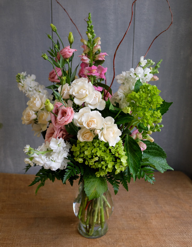 Flower arrangement with Lisianthus, Roses, Snapdragons, Stock and Hydrangea