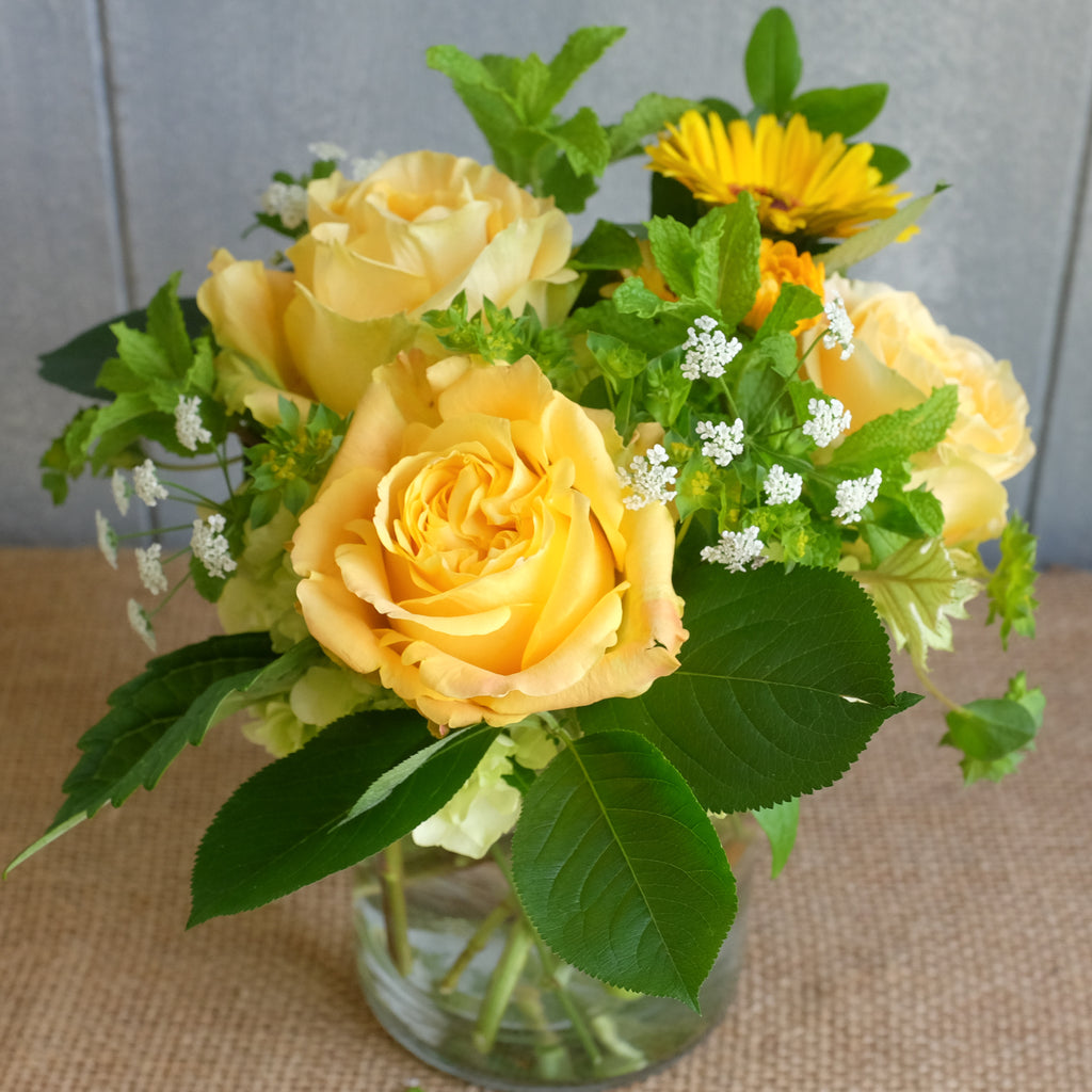 Petite bouquet with yellow roses by Michlers Florist.
