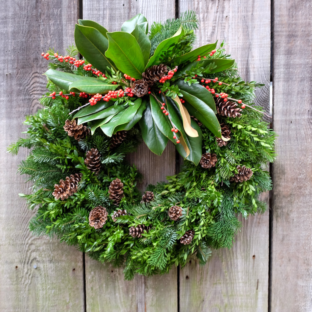 Fir and Boxwood Wreath with Pine Cones, Magnolia and Ilex. By Michler's Florist