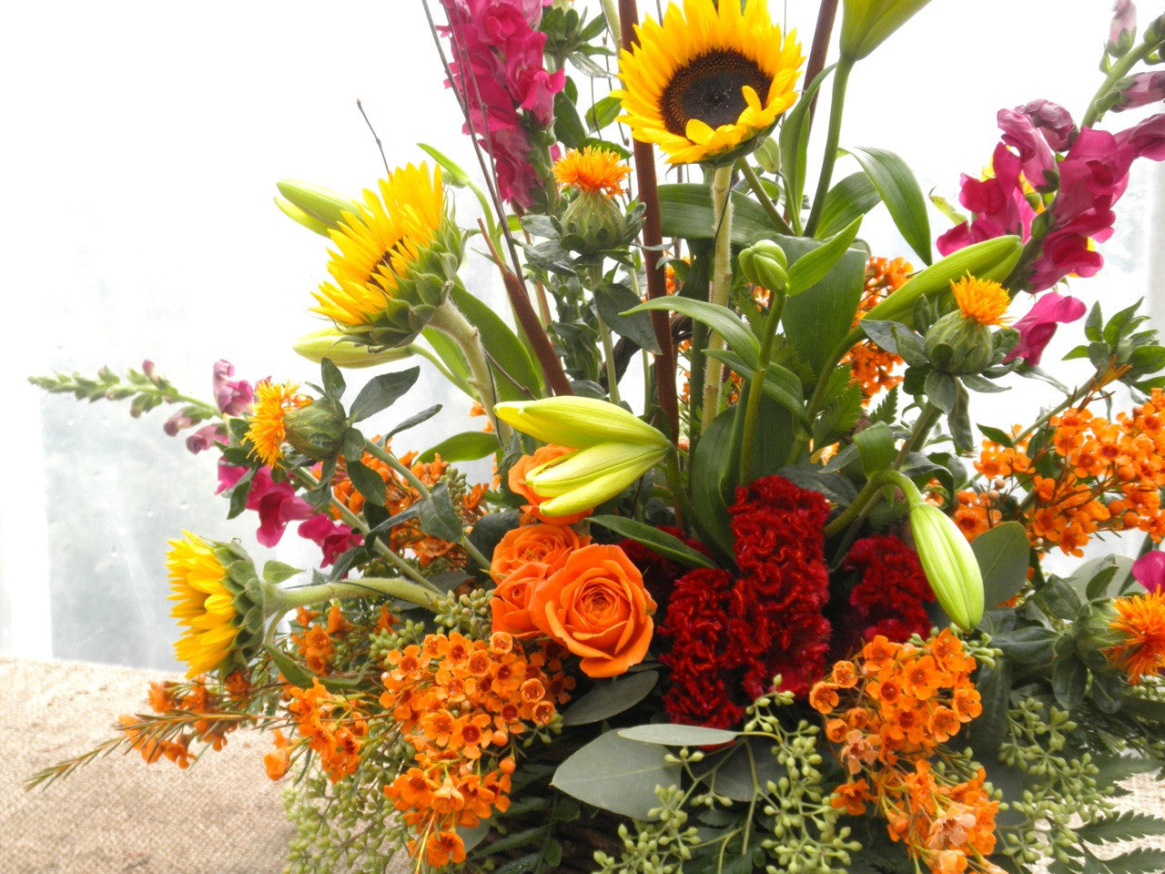 Fall Floral Arrangement with sunflowers, safflowers, and celosia 