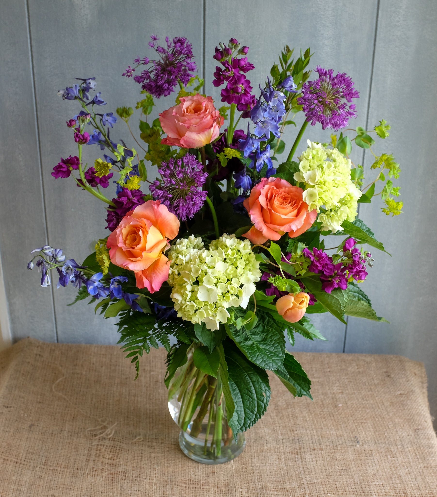 Jersey Flower Design with Alliums, Tulips, and Delphinium by Michler's Florist