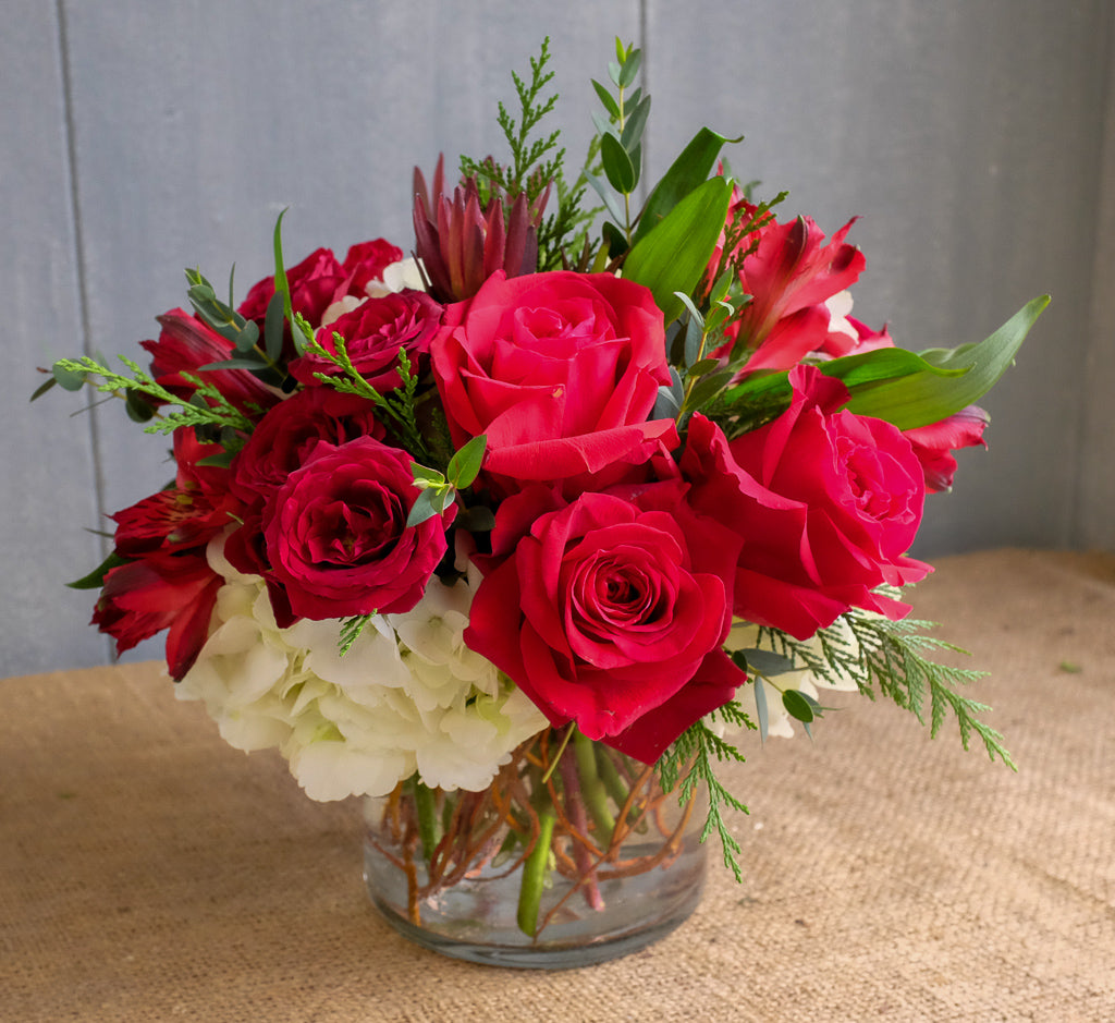 Ladybird flower bouquet, designed with red roses and hydrangea by Michler's Florist in Lexington, KY