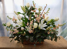 Lisbon: Wicker funeral basket with white roses, lilies and peach stock. Designed by Michler's Florist in Lexington, KY