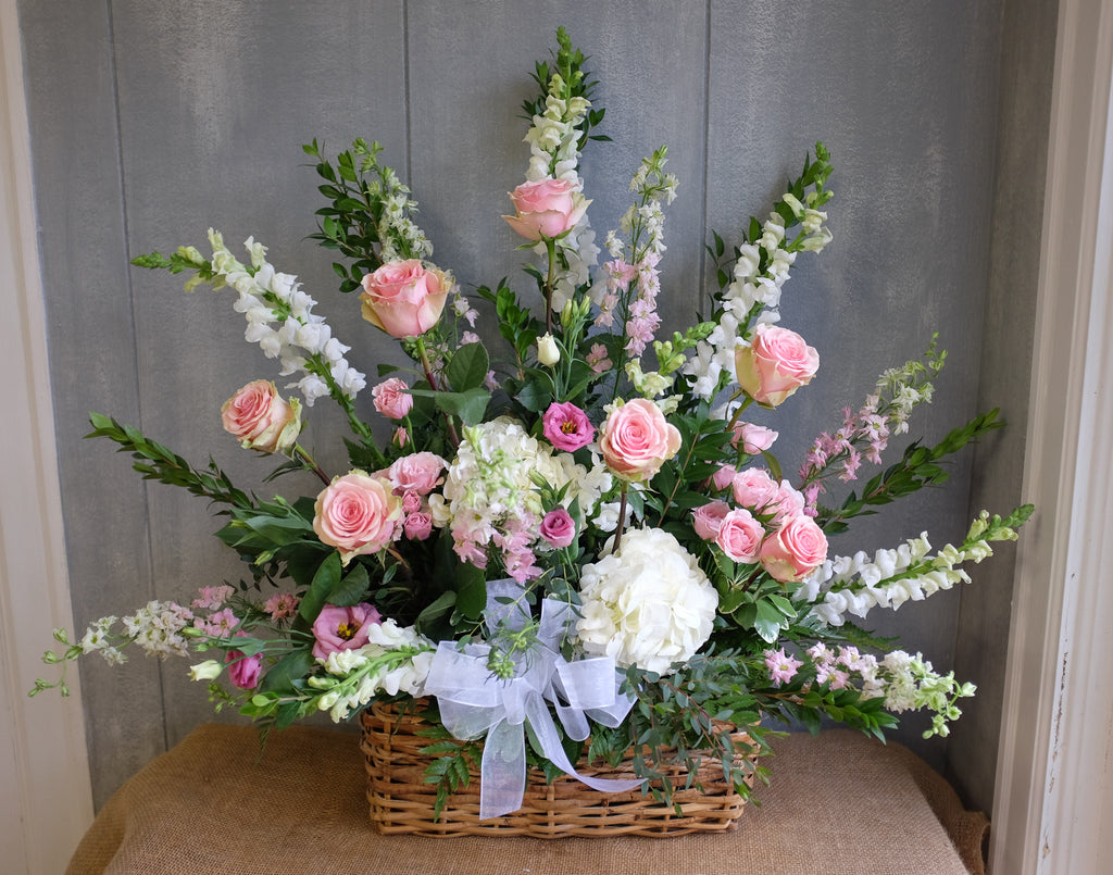 Floral basket spray with white and pink flowers 