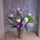 tall and elegant floral arrangement with roses, lisianthus, stock, and natural accents by Michler's Florist in Lexington, KY
