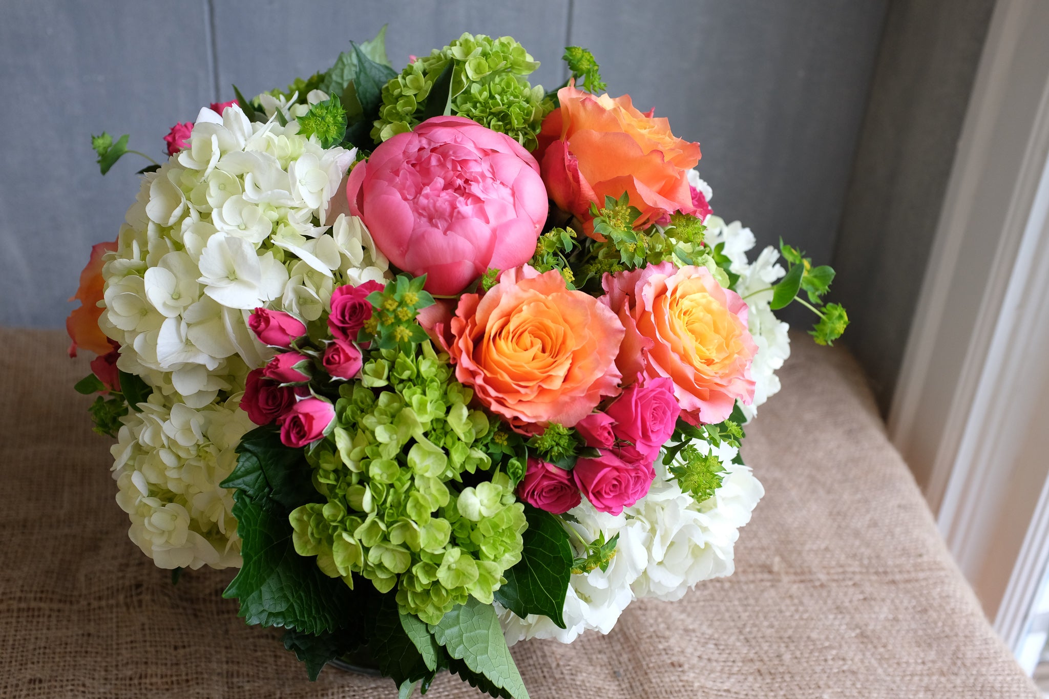 Lush and cheerful flower bouquet designed by Michler's Florist