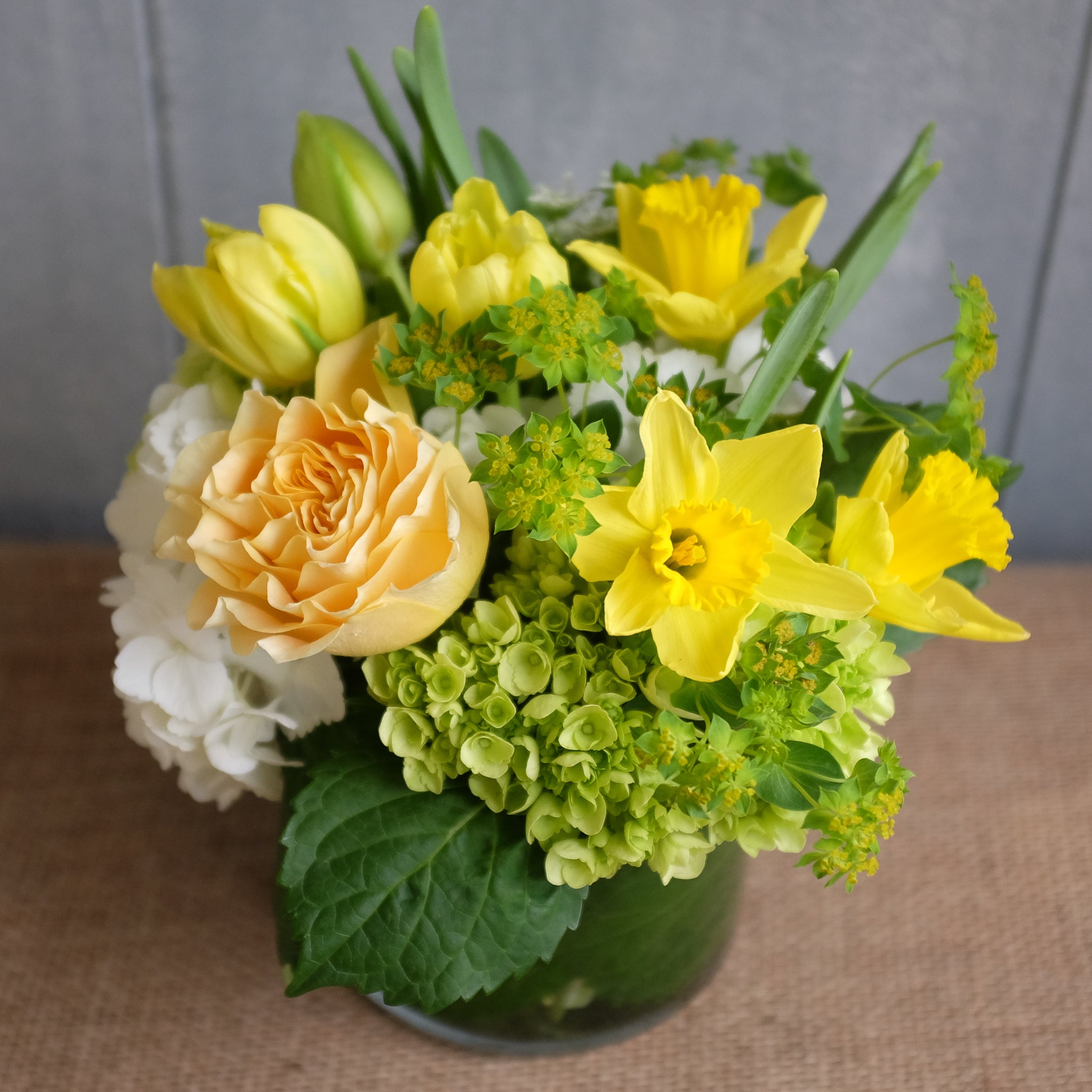Sunny yellowfins white and green spring bouquet by Michler Florist, Lexington KY.
