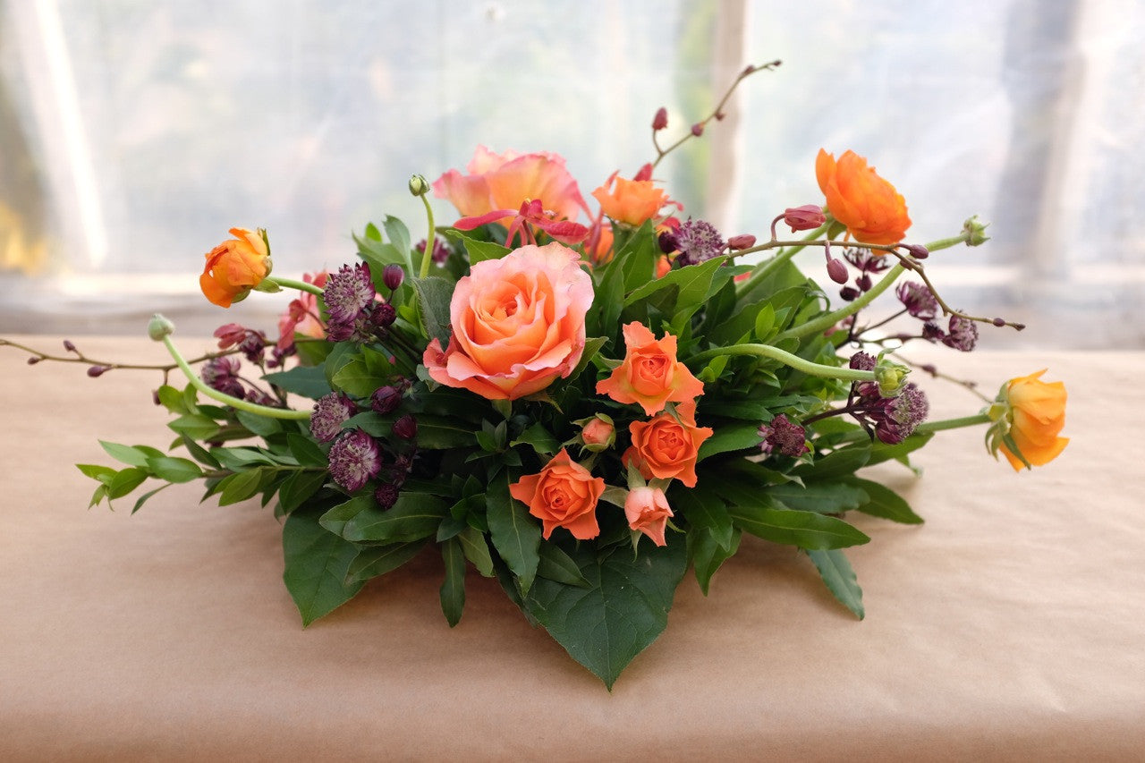 Norland: Thanksgiving centerpiece with roses, ranunculus and orchids. Michler's Florist in Lexington, KY