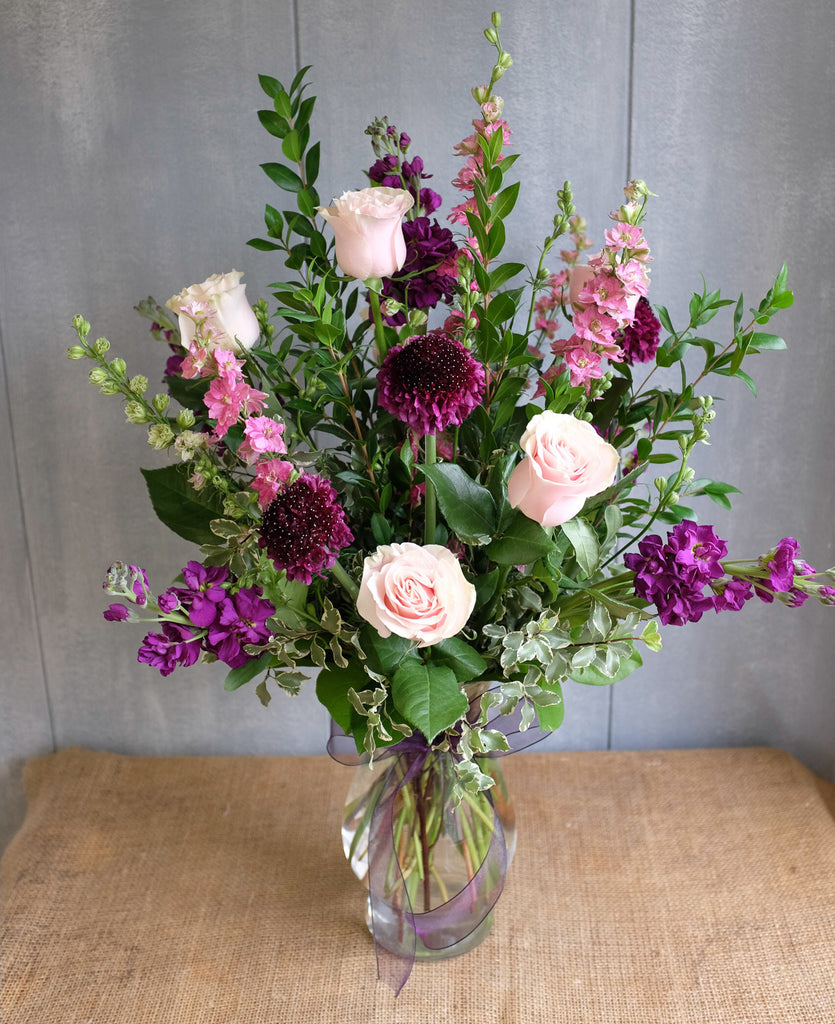 Tall and elegant bouquet of pink and purple flowers