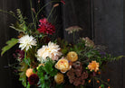Dynamic bouquet with garden roses, dahlias and field flowers