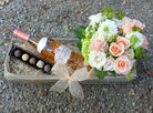 Gift crate with wine flowers and chocolates