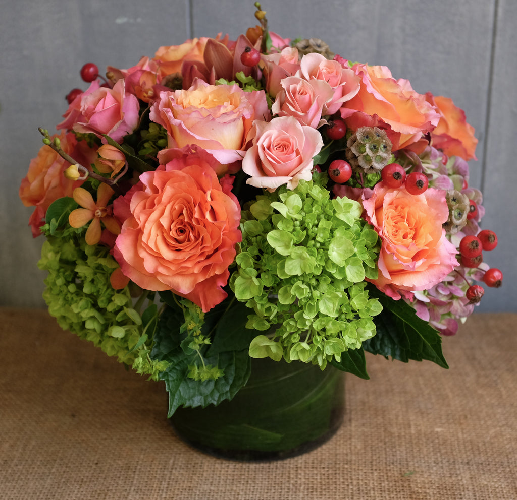 Bright and warm seasonal low and lush design with unique accents by Michler's Florist 