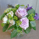 Flower bouquet by Michlers Florist featuring lavender roses.
