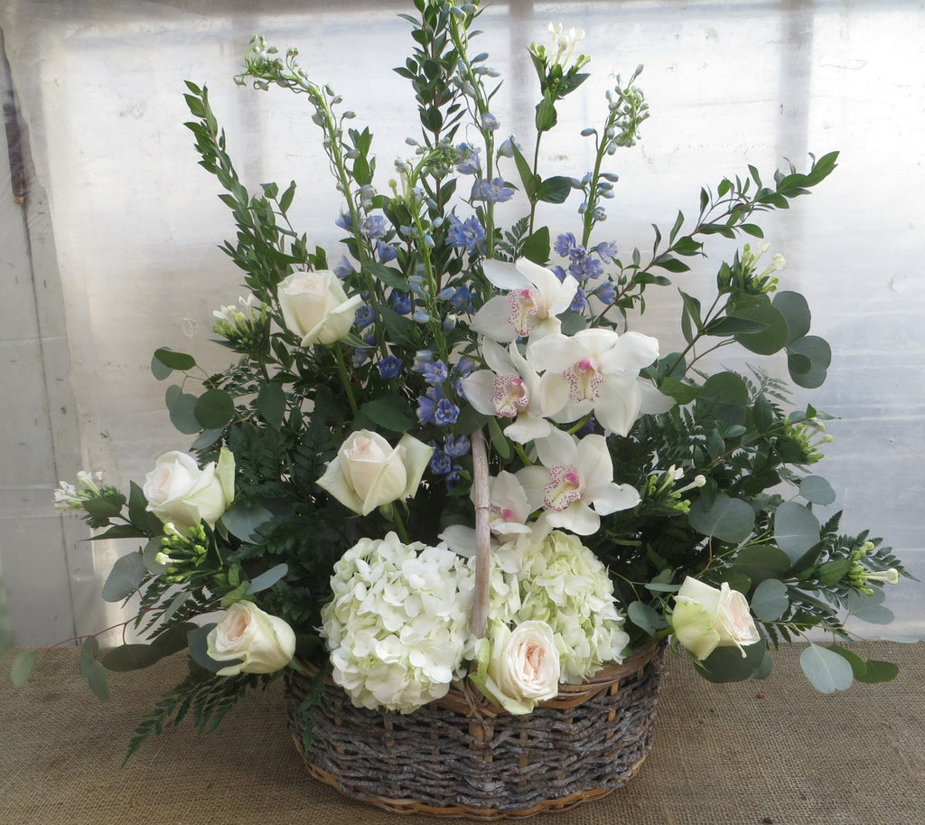 Toronto Funeral Basket: Hydrangea, Roses and Cymbidium Orchids. Designed by Michler's Florist in Lexington, KY