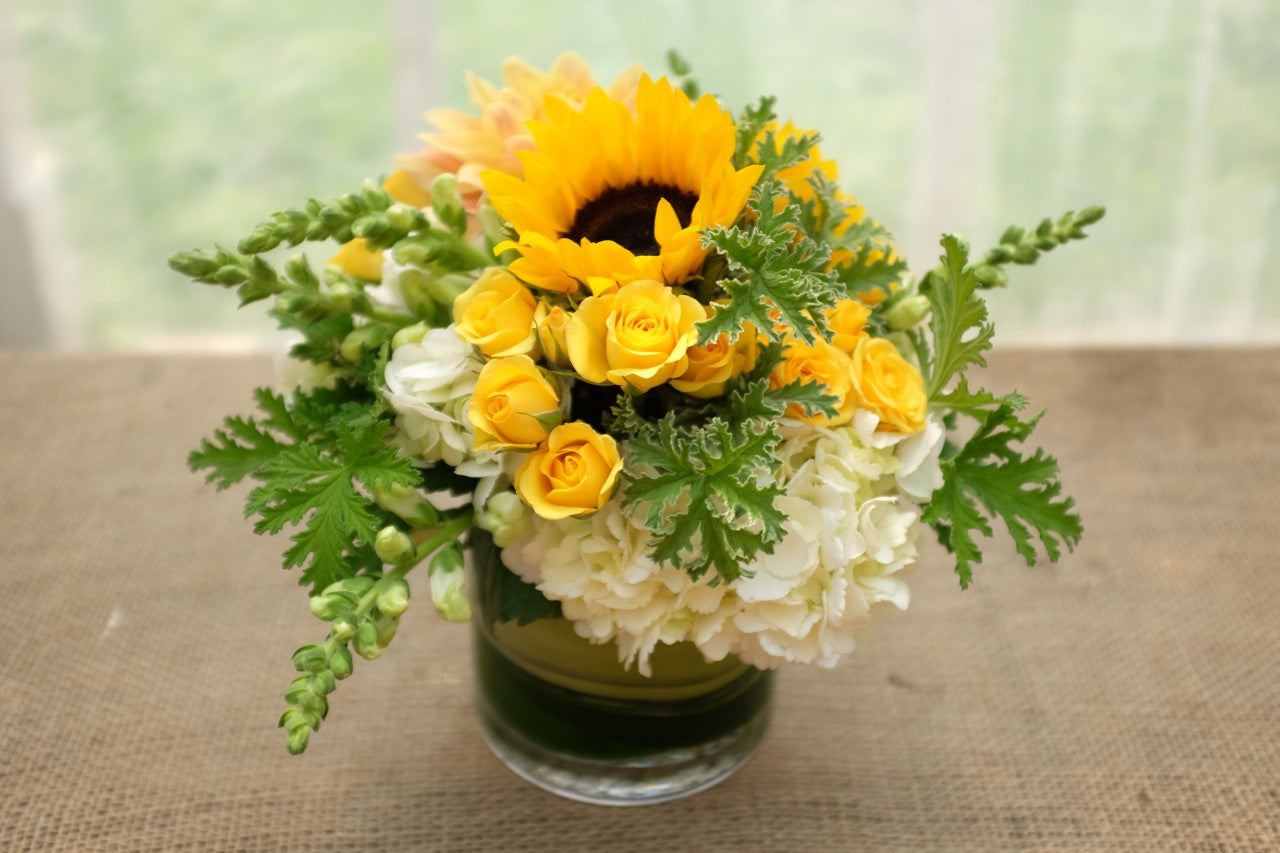 Larkhill: Yellow flower arrangement with Sunflowers, roses and hydrangea. Designed by Michler's Florist in Lexington, KY