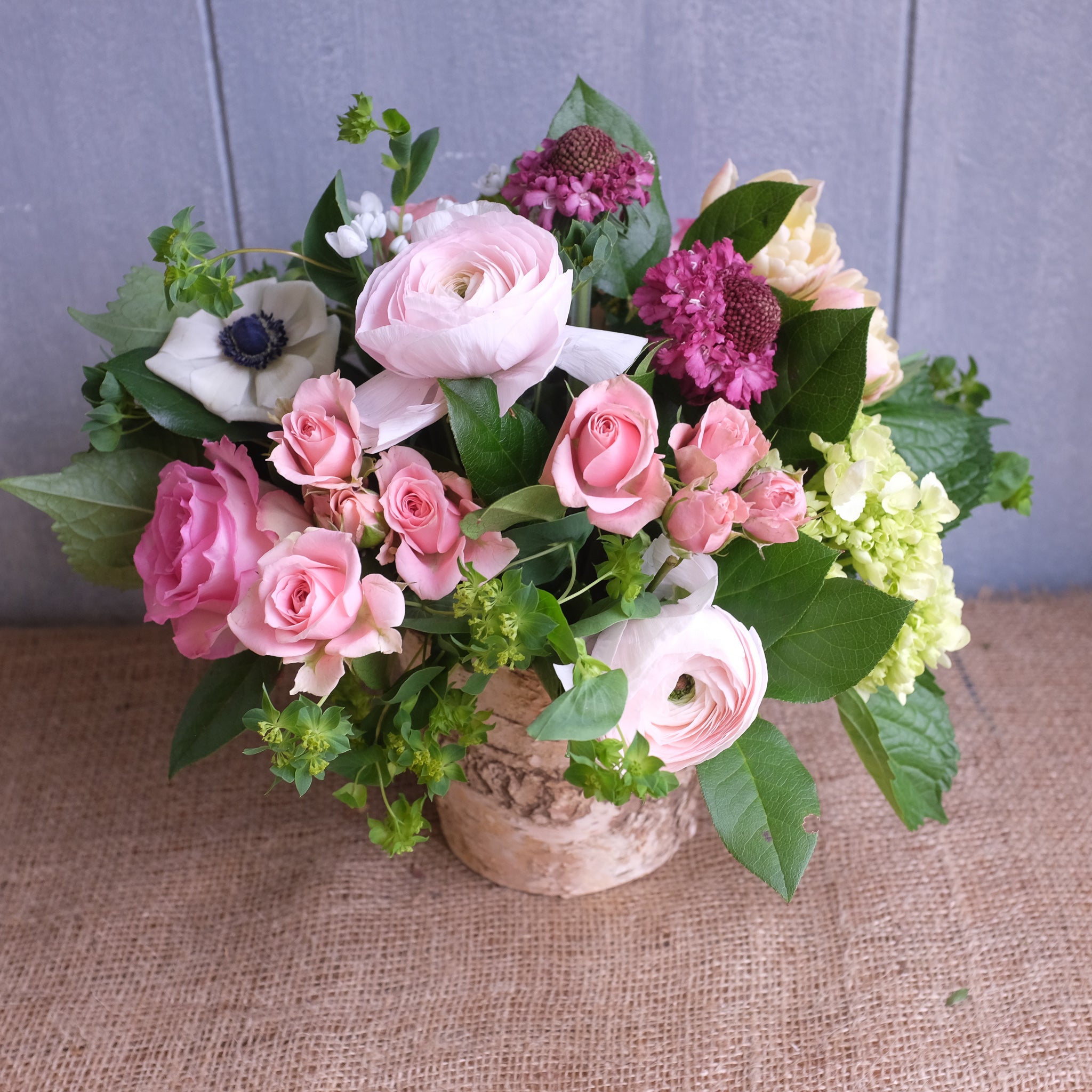 Flower Design with: Clooney Ranunculus, Roses, Scabiosa, Anemones by Michler's Florist