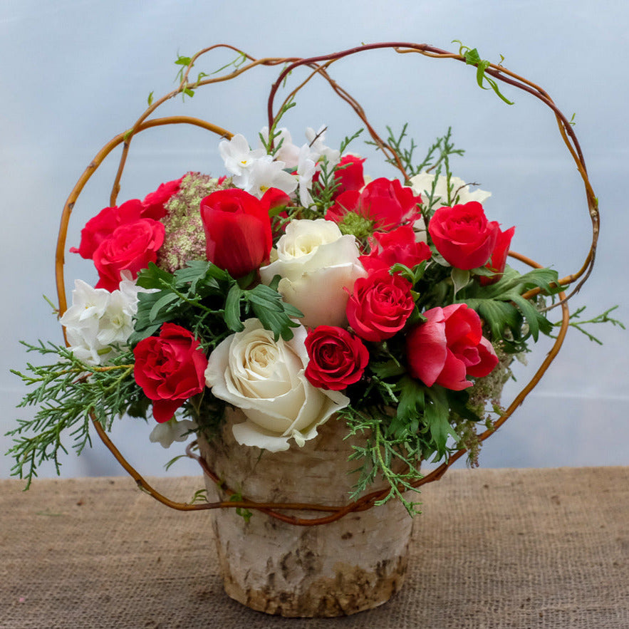 Vienna: flower arrangement in birch pot with red and white roses, designed by Michler's Florist in Lexington, KY