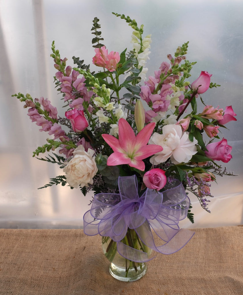 Wilmington: Pink flower arrangement with lilies, peonies, snap dragons and roses. Michler's Florist