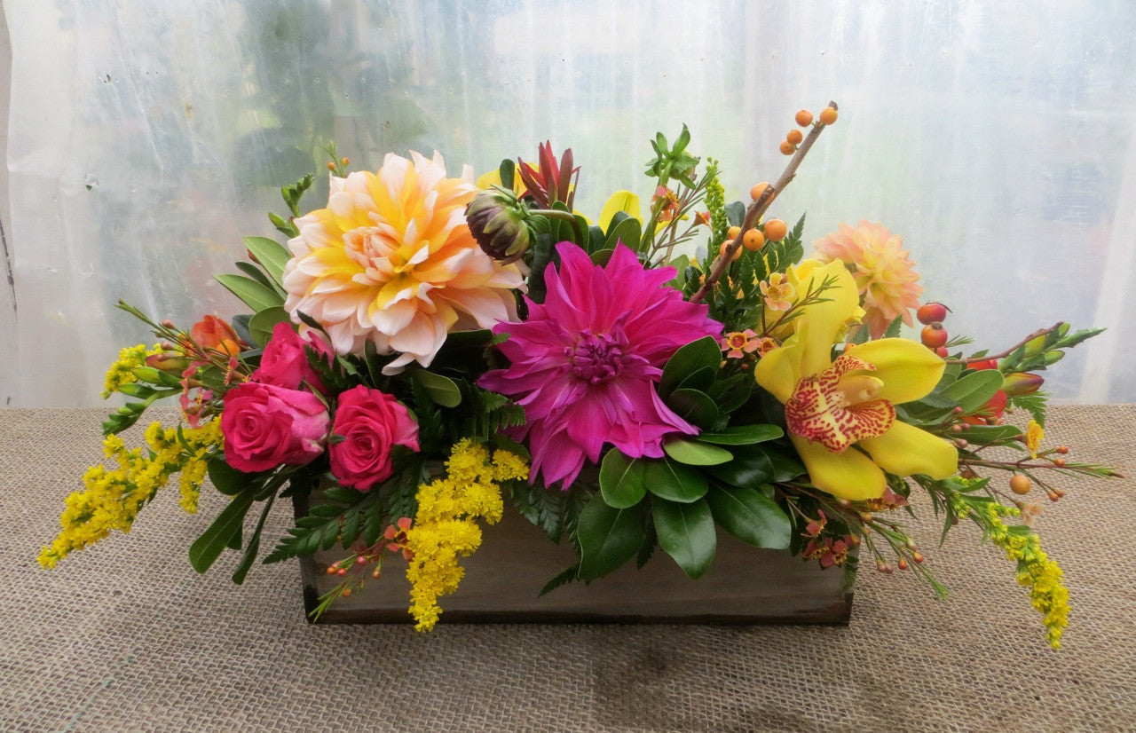 Zandale: Floral Centerpiece with Cymbidium Orchid and Dahlia blooms. Designed by Michler's Florist in Lexington, KY. 
