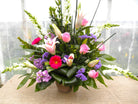 Floral Arrangement by Michler's Florist with Star gazer lilies, pink roses, gerbera daisies 