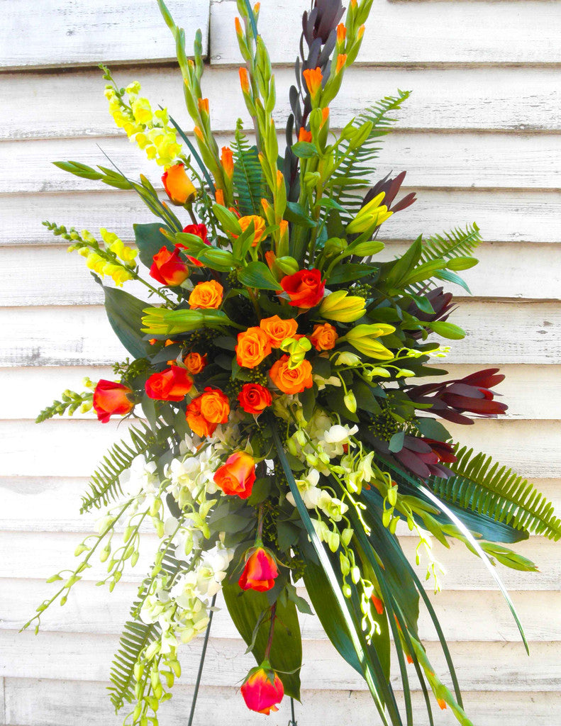Vibrant Standing Spray: Yellow and Orange Flowers. Designed by Michler's Florist in Lexington, KY